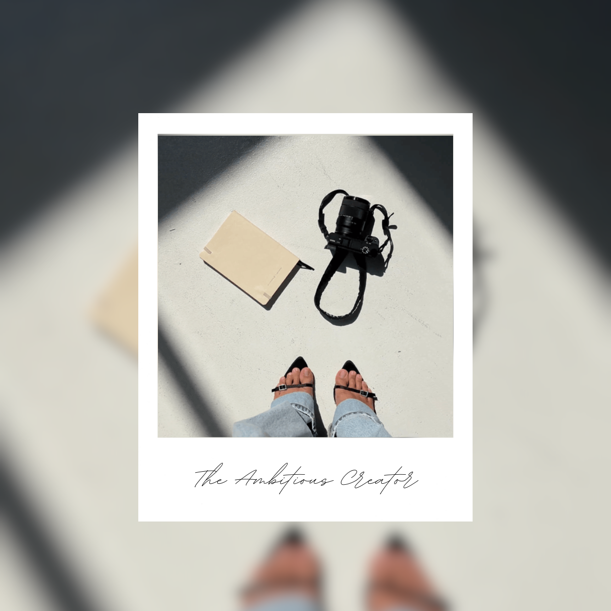 An ambitious creator, a marketer, photographer or other creative taking an image of her jeans and her heels, with a handbag and a large camera on the floor 