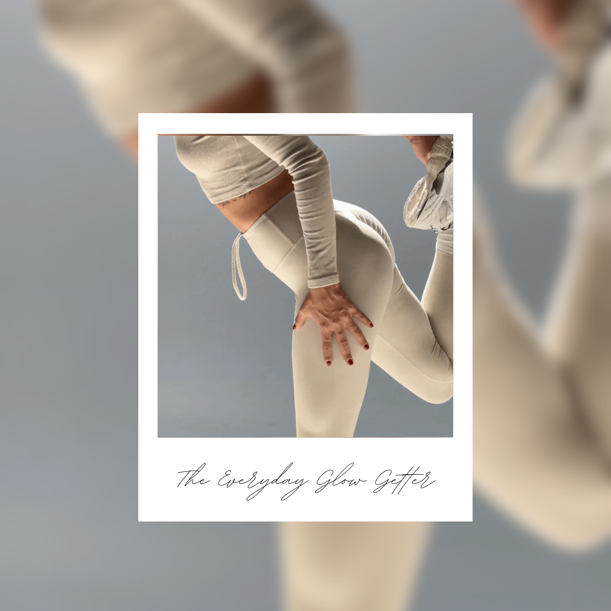 A woman in a beige workout outfit, stretching her leg 
