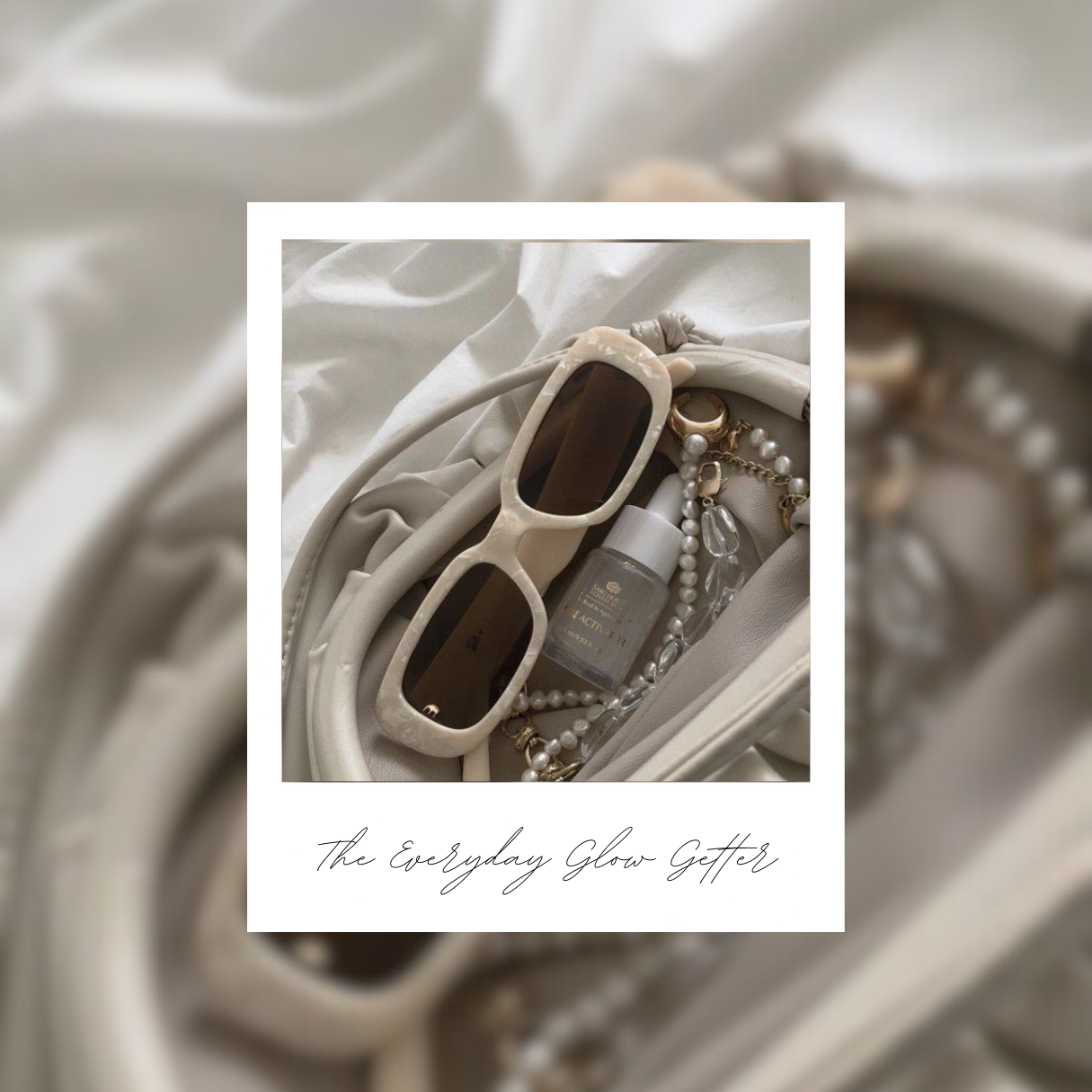 A top down view of a womans handbag with accessories including white sunlasses, some jewellery, a perfume or beauty product