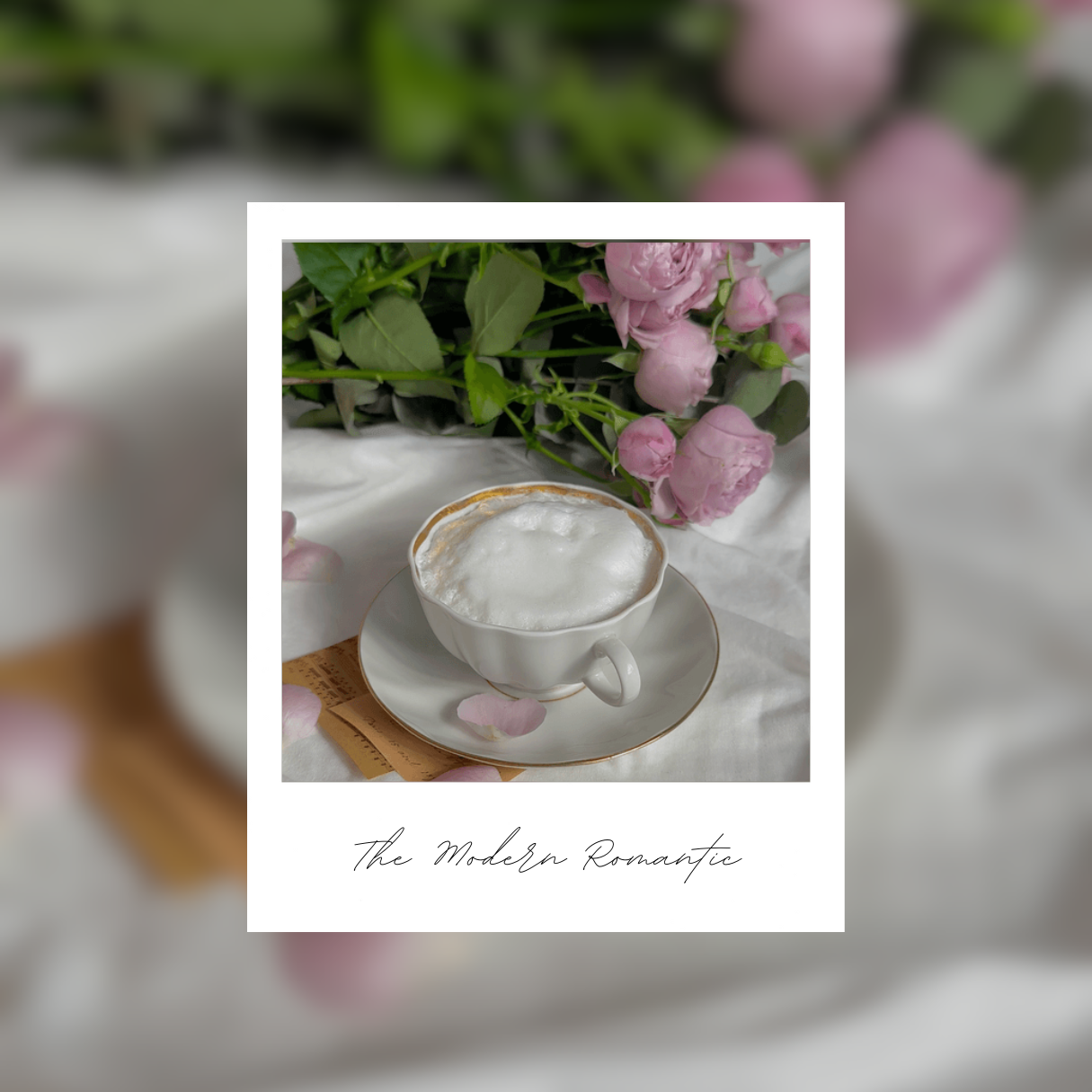 A cappuccino on a white sheet with  a bunch of pink roses